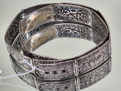 Lot 58 - An antique hinged panel belt. Each panel is...