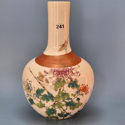 Lot 241 - A Chinese bottle vase tied with a gilt cash...