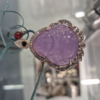 Lot 246 - Two Chinese white metal good luck pendants,...