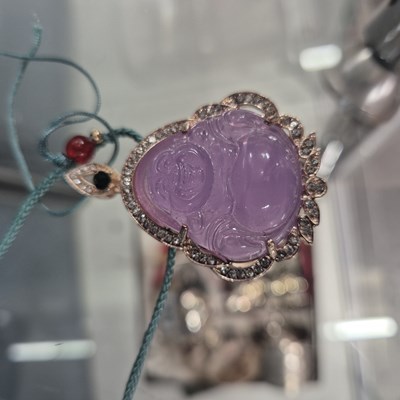 Lot 246 - Two Chinese white metal good luck pendants,...