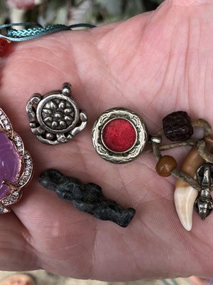 Lot 246 - Two Chinese white metal good luck pendants,...