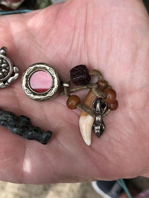 Lot 246 - Two Chinese white metal good luck pendants,...