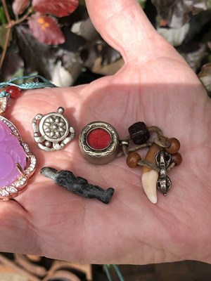 Lot 246 - Two Chinese white metal good luck pendants,...