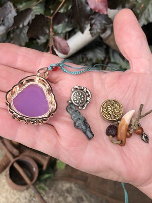 Lot 246 - Two Chinese white metal good luck pendants,...