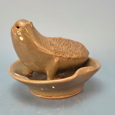 Lot 252 - A Chinese celadon glazed water dropper in the...