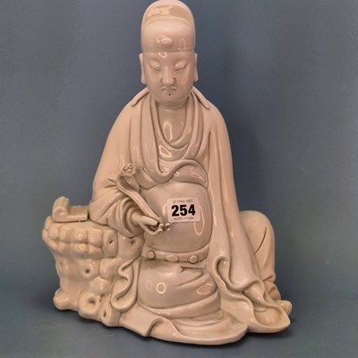Lot 254 - A blanc de Chinese figure of a scholar seated...