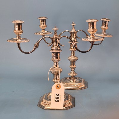 Lot 255 - A pair of silver two light candelabra, London...