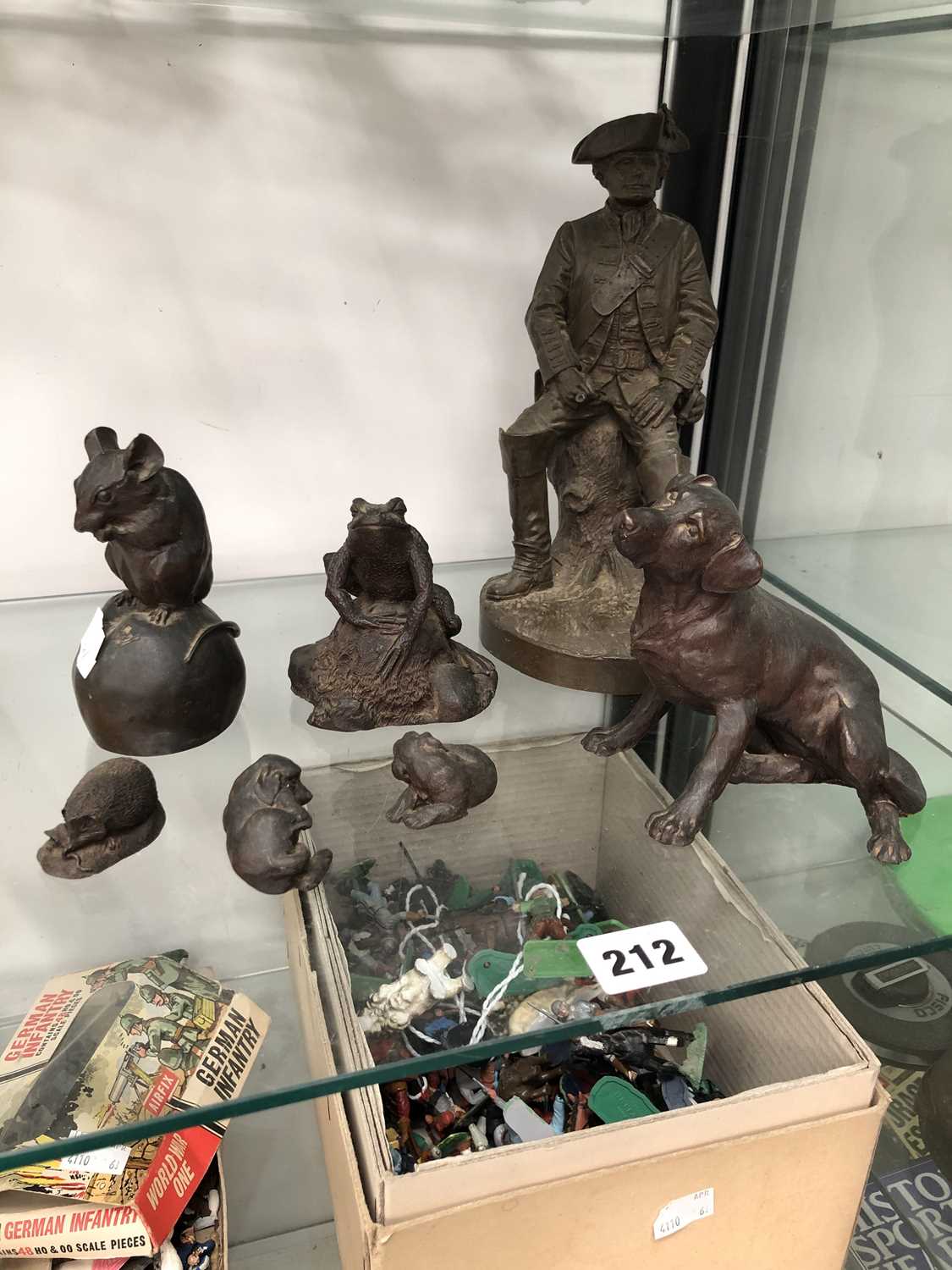 Lot 212 - A group of seven cast bronzed figures.