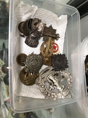 Lot 216 - Military cap badges, buttons, etc.