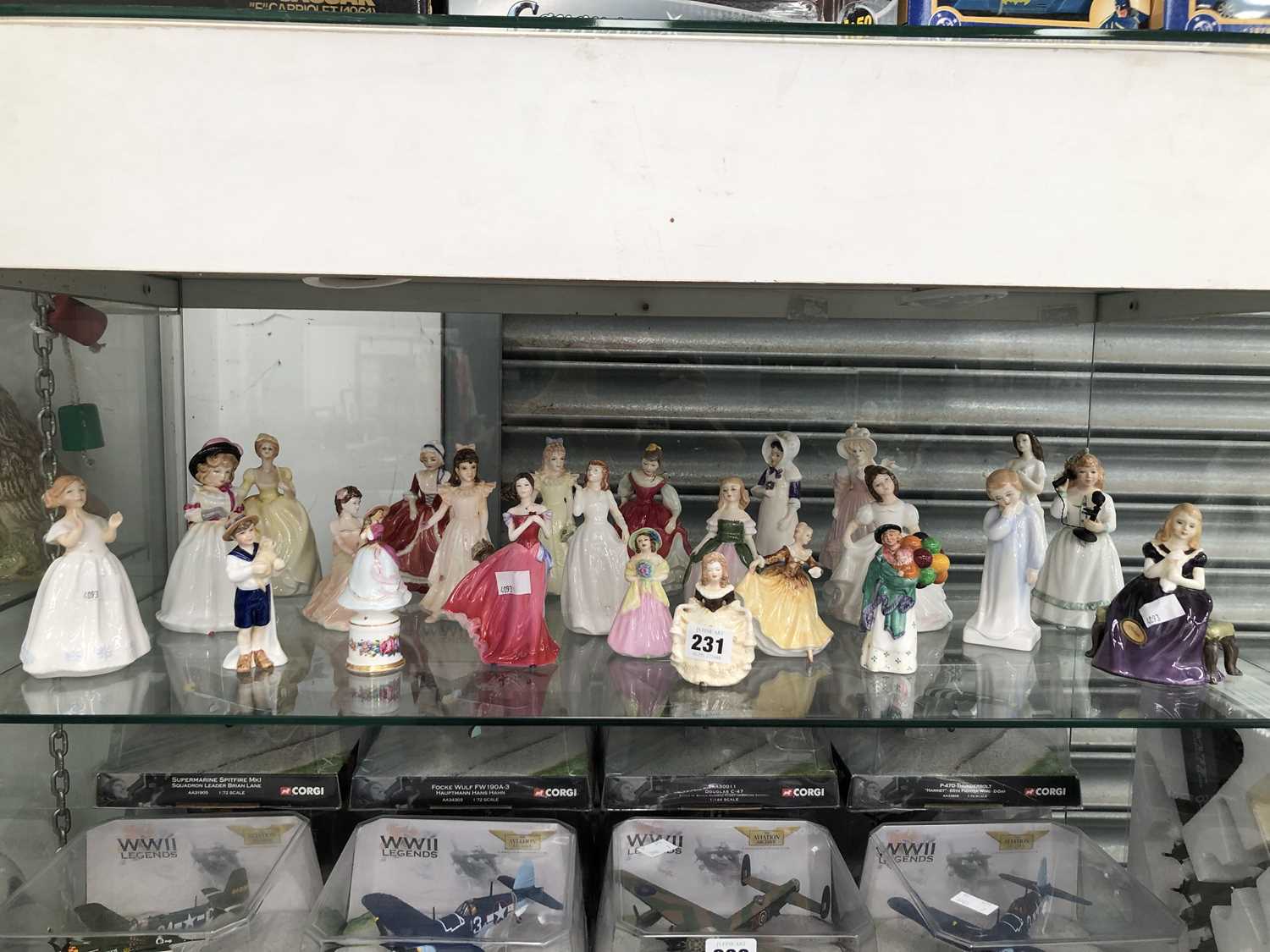 Lot 231 - A collection of figurines by Royal Doulton and...