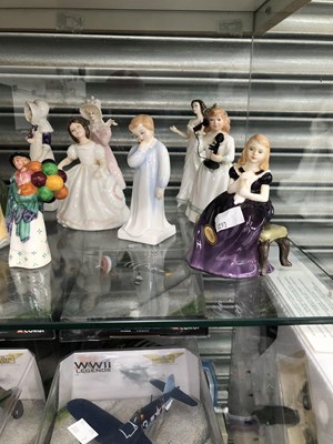 Lot 231 - A collection of figurines by Royal Doulton and...
