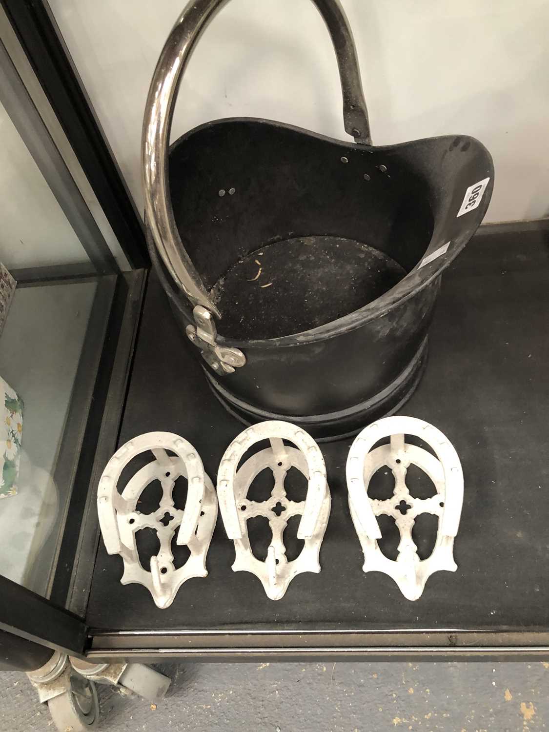 Lot 360 - A coal bucket and three decorative horseshoe...