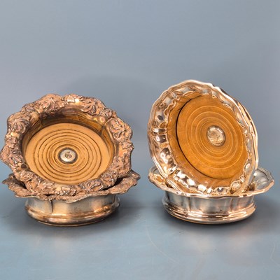 Lot 258 - Two pairs of plated wine coasters, the earlier...