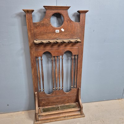 Lot 282 - An Arts and Crafts oak billiard cue stand...