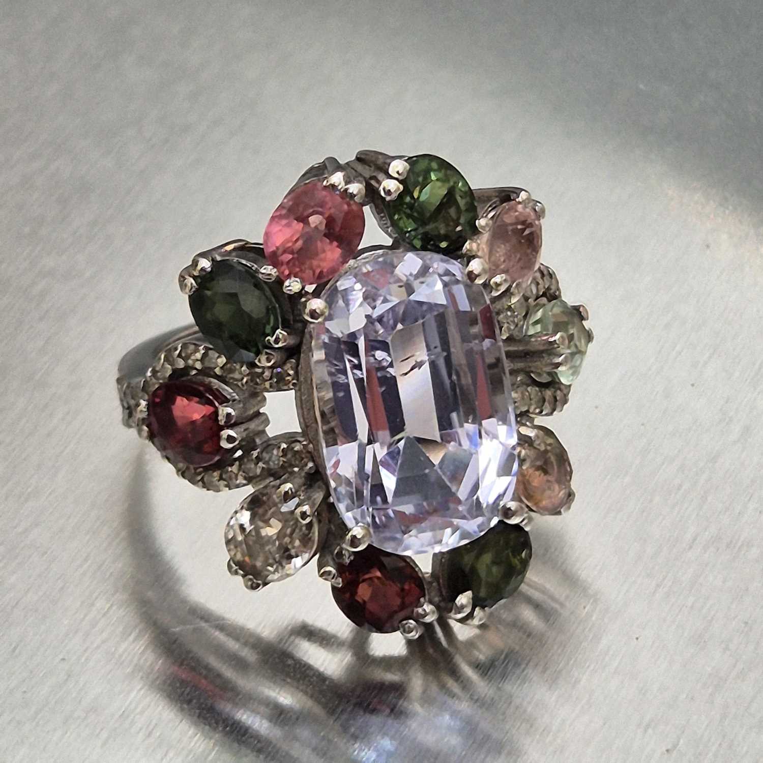 Lot 29 - A large and ornate silver multi-gem set dress...