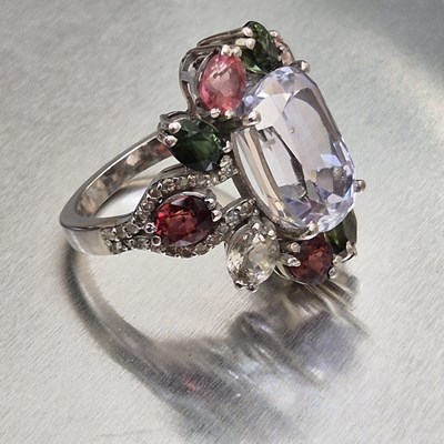 Lot 29 - A large and ornate silver multi-gem set dress...