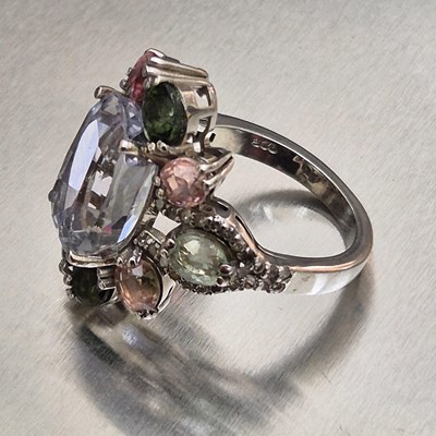 Lot 29 - A large and ornate silver multi-gem set dress...