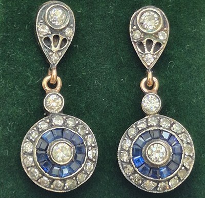 Lot 60 - A pair of sapphire and diamond Art...