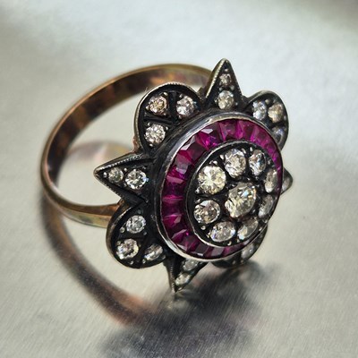 Lot 66 - A ruby and diamond star-shaped cluster dress...