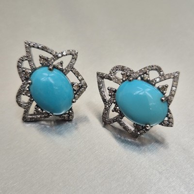 Lot 73 - A pair of oval cabochon turquoise and diamond...