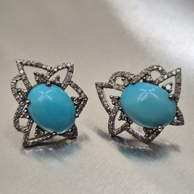 Lot 73 - A pair of oval cabochon turquoise and diamond...