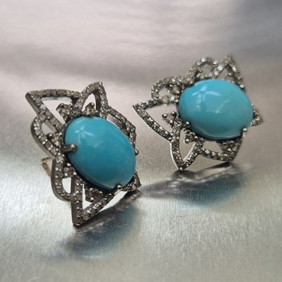 Lot 73 - A pair of oval cabochon turquoise and diamond...
