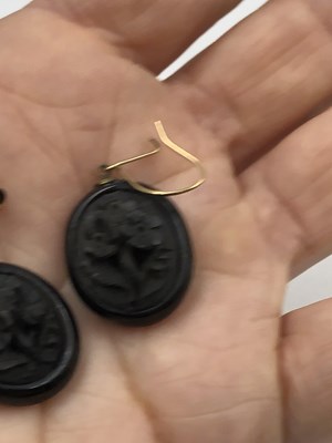 Lot 22 - Three pieces of carved mourning jewellery. A...