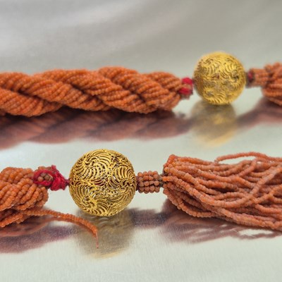Lot 65 - An antique coral-beaded multi-strand rope...