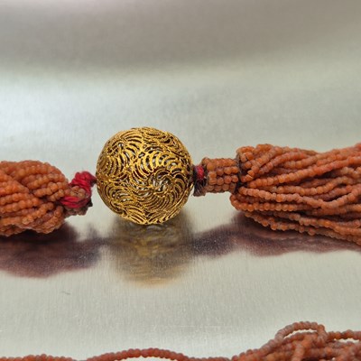 Lot 65 - An antique coral-beaded multi-strand rope...