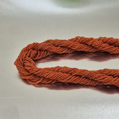 Lot 65 - An antique coral-beaded multi-strand rope...