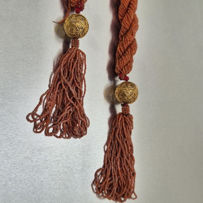 Lot 65 - An antique coral-beaded multi-strand rope...