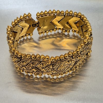 Lot 70 - A vintage eastern panel bracelet. The bracelet...
