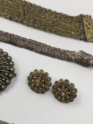 Lot 42 - A Chinese silver gilt character panel bracelet...