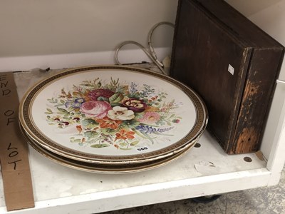 Lot 560 - A pair of flower painted pottery circular wall...