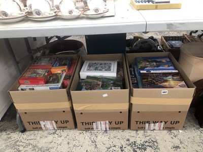 Lot 562 - A collection of boxed jigsaw puzzles