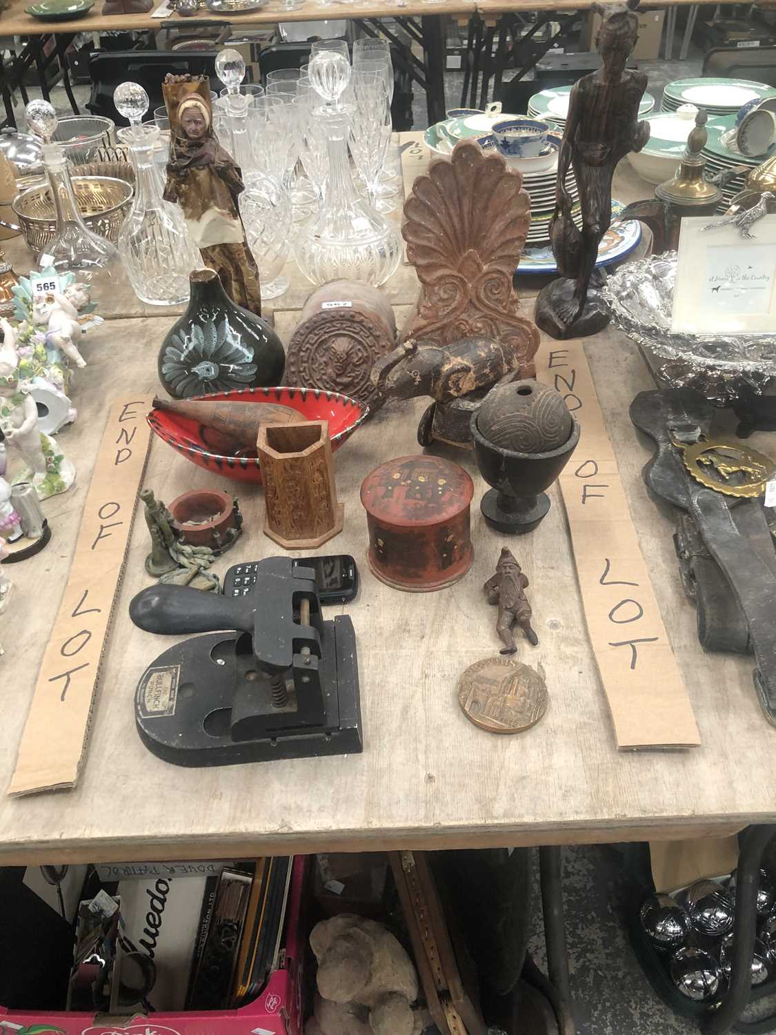 Lot 567 - Two decorative terracotta roof end tiles, a...