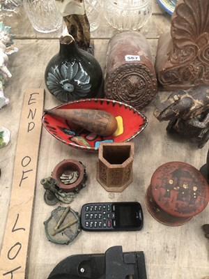Lot 567 - Two decorative terracotta roof end tiles, a...