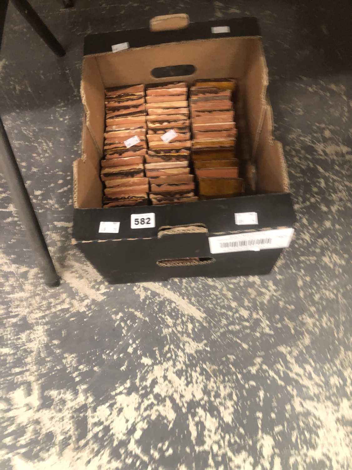 Lot 582 - A box of brown glazed tiles