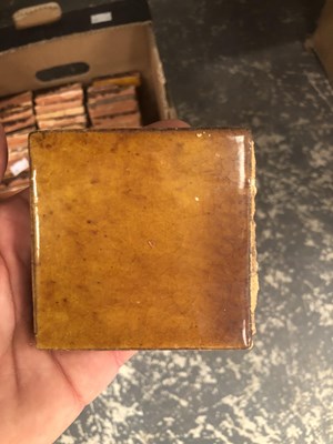 Lot 582 - A box of brown glazed tiles