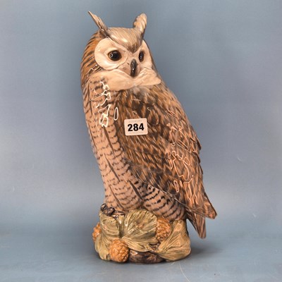 Lot 284 - A Copenhagen figure of an owl perched upon a...