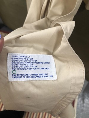 Lot 190 - A Yves Saint Laurent long ladies' trench coat....