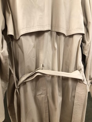 Lot 190 - A Yves Saint Laurent long ladies' trench coat....