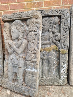 Lot 702 - Two Eastern relief-decorated temple panels.