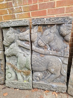 Lot 703 - A pair of Eastern relief-decorated temple...