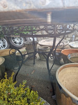 Lot 711 - A large circular zinc-topped patio table.