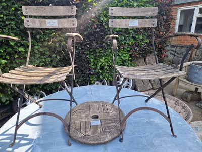 Lot 713 - Two garden chairs and a lazy Susan.