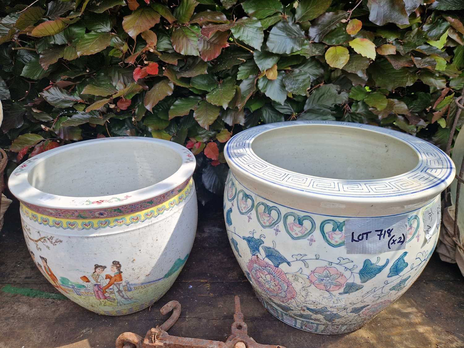 Lot 718 - Two oriental fish bowl form garden planters.