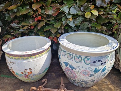 Lot 718 - Two oriental fish bowl form garden planters.