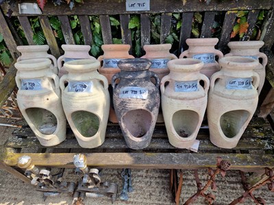 Lot 720 - Eleven terracotta jars.