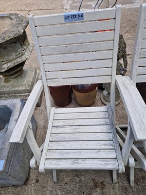 Lot 737 - Four Folding hardwood garden chairs.